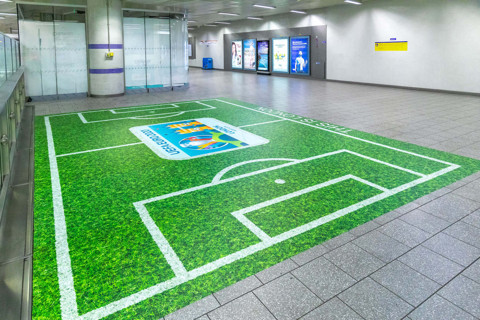 Floor Graphics of a Football Pitch on the London Underground