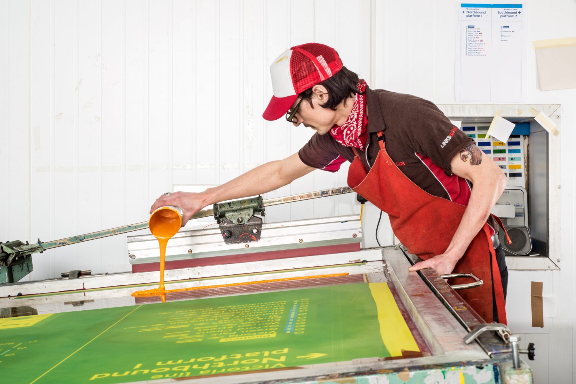 lost art of screen printing, man pouring ink